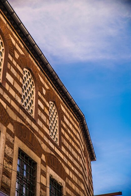 Low angle view of historical building against cloudy sky