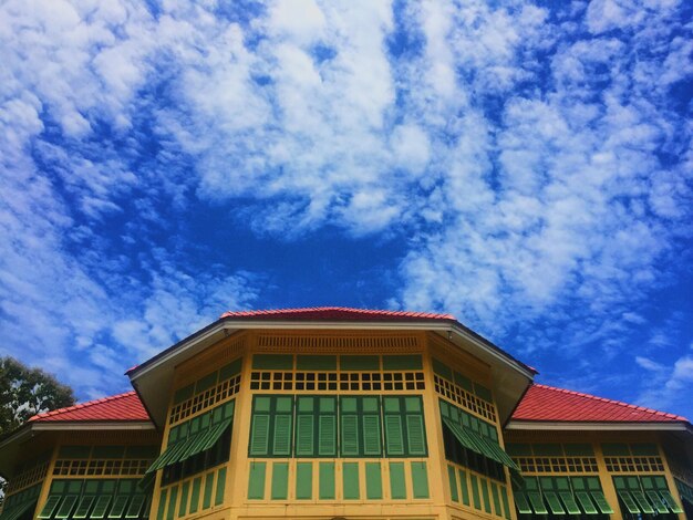 Low angle view of house against blue sky