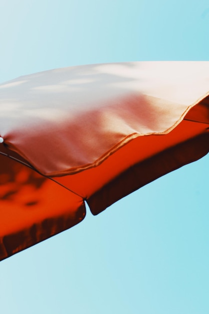 Low angle view of ice cream against blue sky