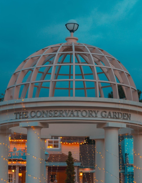 Low angle view of illuminated building against blue sky