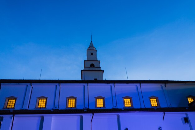 Low angle view of illuminated building against blue sky