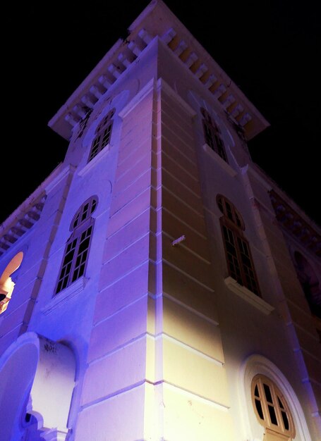 Low angle view of illuminated building at night