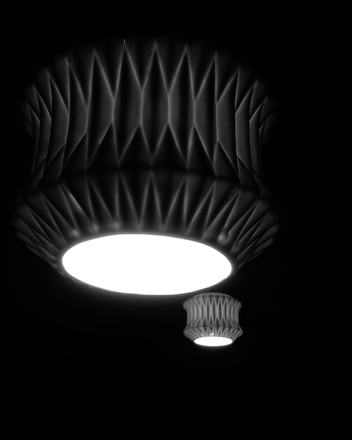 Low angle view of illuminated electric lamp