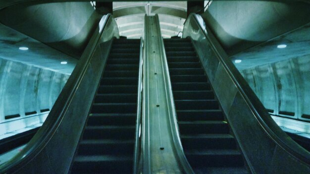 Low angle view of illuminated escalator