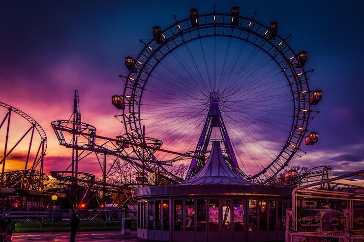 Photo low angle view of illuminated ferris wheel at night