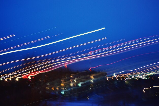 Low angle view of illuminated fireworks against sky at night