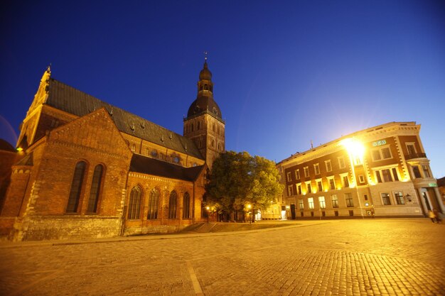 Low angle view of illuminated historical building against blue sky at dusk