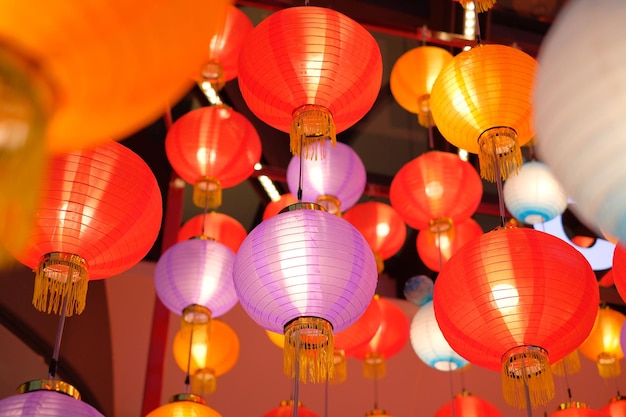 Low angle view of illuminated lanterns hanging on ceiling