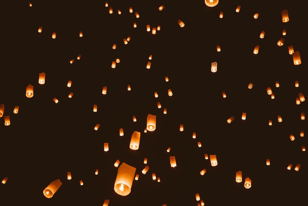 Low angle view of illuminated lanterns at night