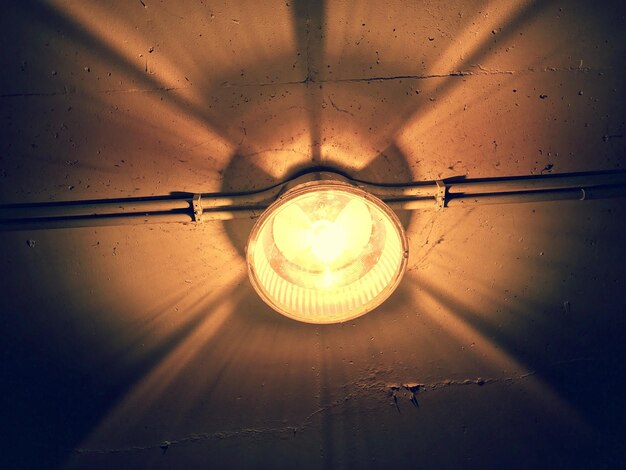 Photo low angle view of illuminated light bulb