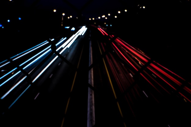 Photo low angle view of illuminated light trails in city at night