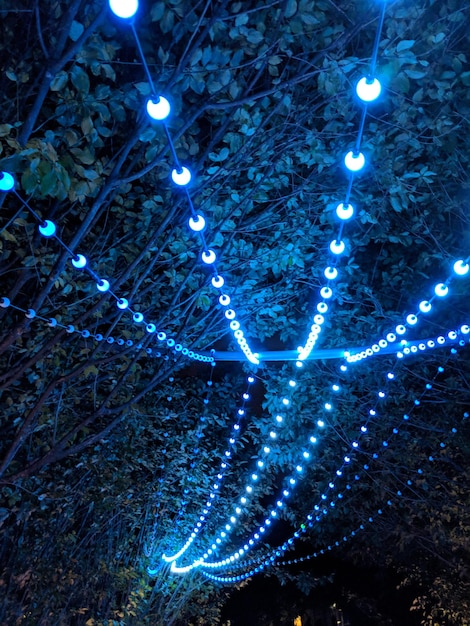 Photo low angle view of illuminated lights at night