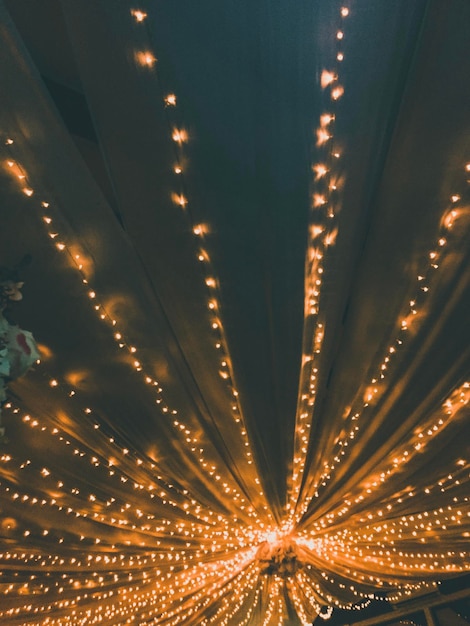 low angle view of illuminated lights at night