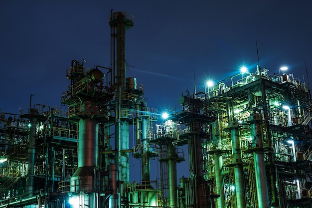 low angle view of illuminated oil industry at night