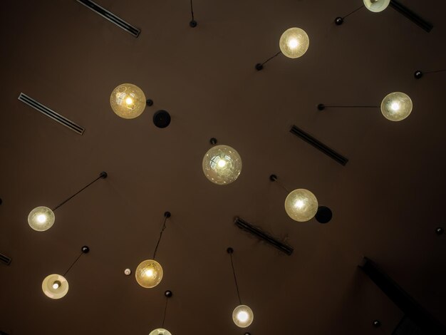 Low angle view of illuminated pendant light