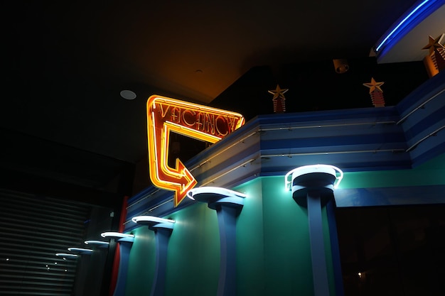 low angle view of illuminated sign at night
