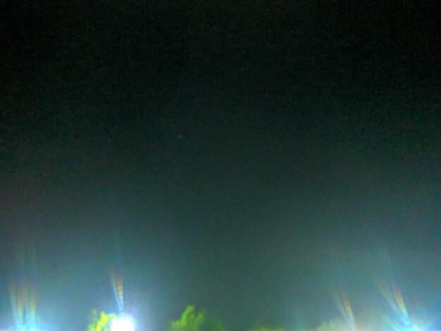 Low angle view of illuminated sky at night