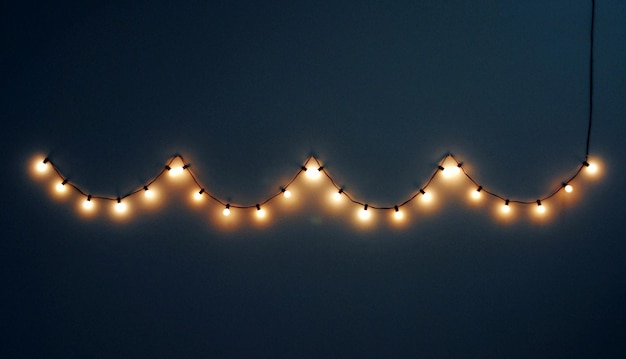 Low angle view of illuminated street lights against sky