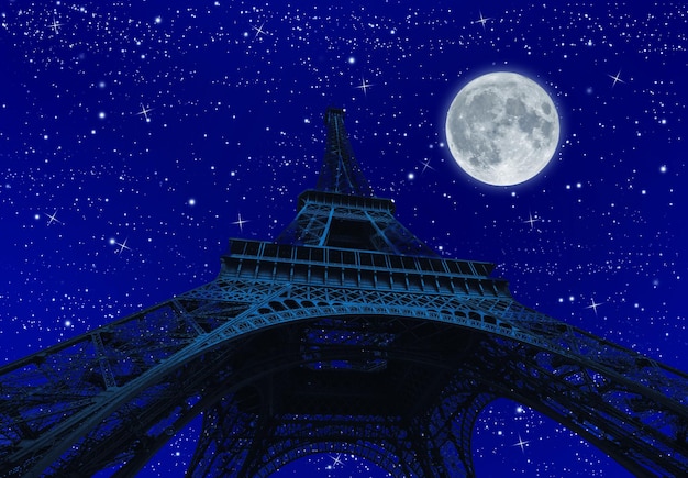low angle view of illuminated tower against sky at night