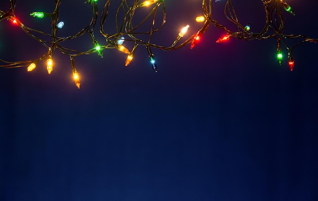 Low angle view of illuminated trees against sky at night