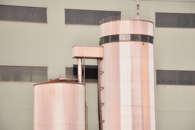 Low angle view of industrial building against sky