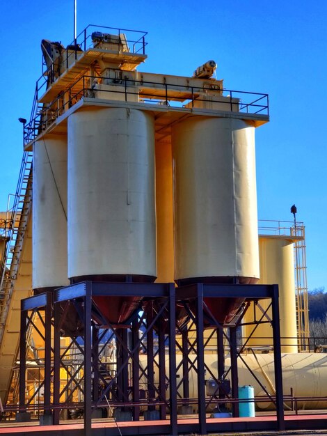 Low angle view of industrial building against sky