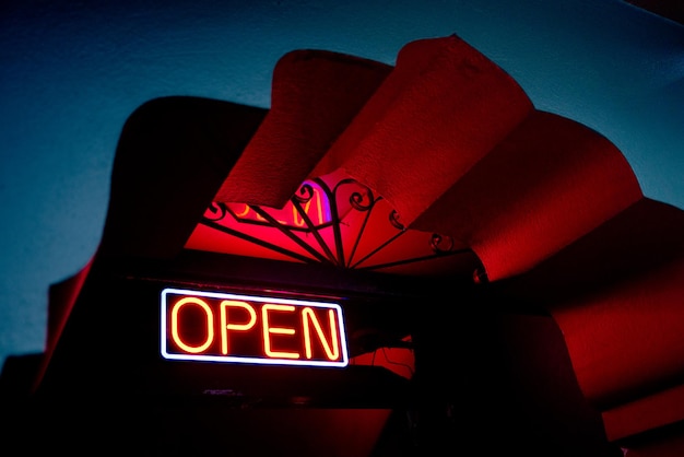Low angle view of information sign at night