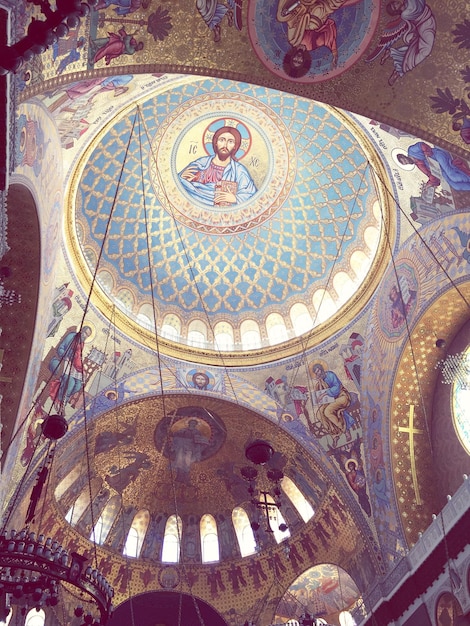 Low angle view of jesus christ painting on church dome