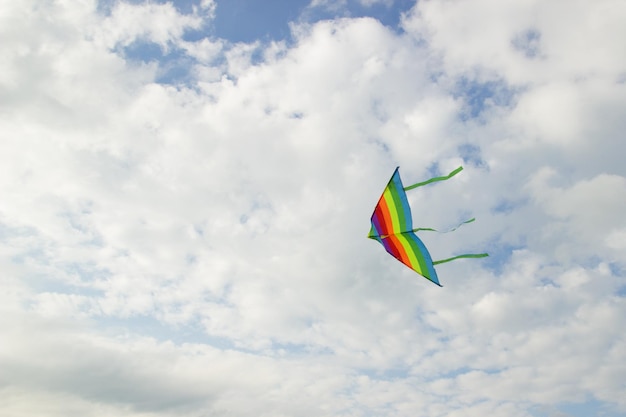 Low angle view of kites flying against sky