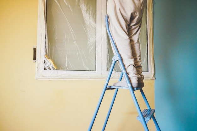 Low angle view of ladder against wall at home