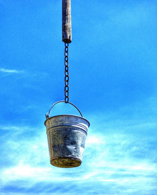 Low angle view of lamp post against blue sky