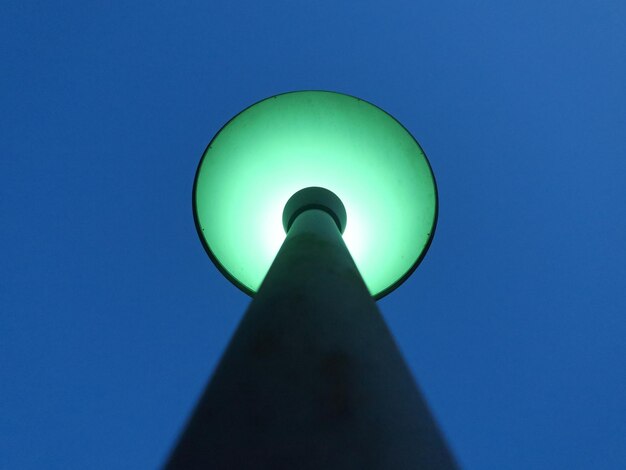 Low angle view of lamp post against blue sky