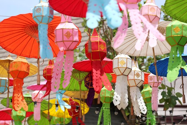 Low angle view of lanterns hanging on clothesline