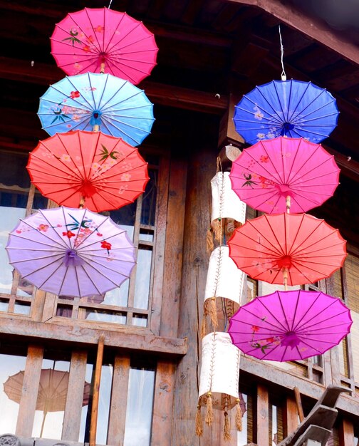 Low angle view of lanterns hanging on wood