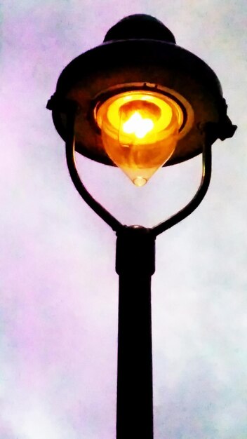 Low angle view of light bulb against sky