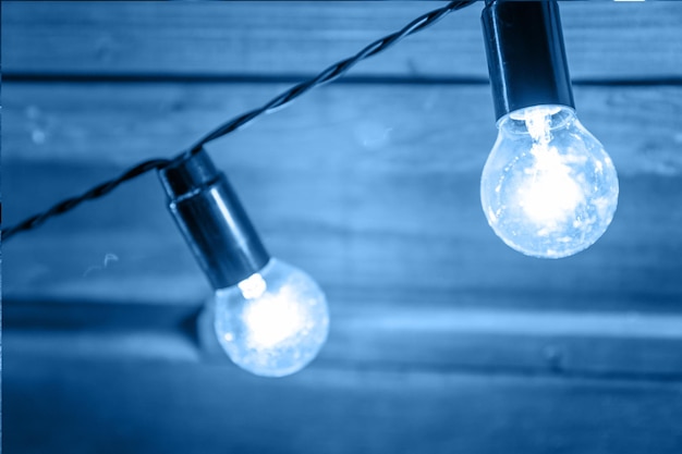 Low angle view of light bulb hanging on ceiling