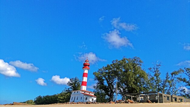 Low angle view of lighthouse against blue sky