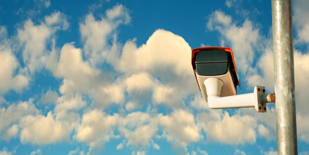 Low angle view of lighting equipment against blue sky