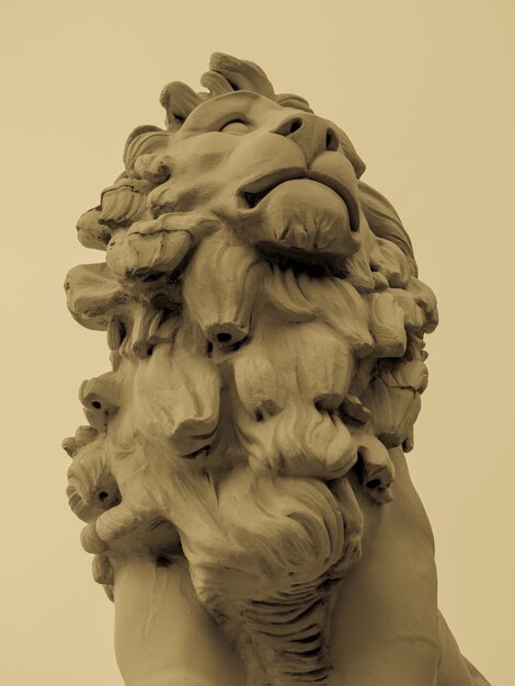 Low angle view of lion statue against sky