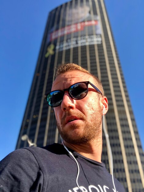 Low angle view of man against tower