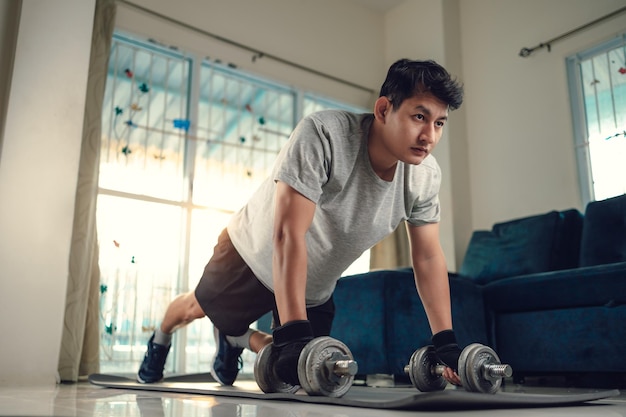 Low angle view of man exercising at home