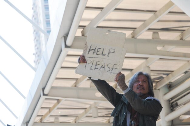 Low angle view of man holding text