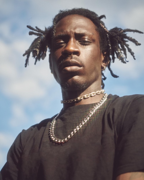 low angle view of man looking away against sky
