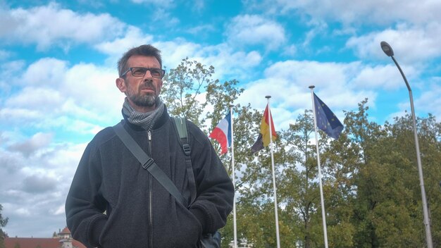 Low angle view of man standing against sky