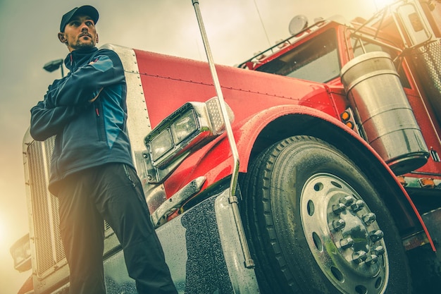 Low angle view of man standing by truck