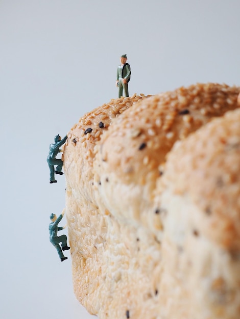 Low angle view of man standing on rock against wall