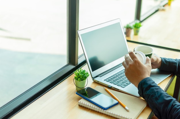 Low angle view of man using laptop on table