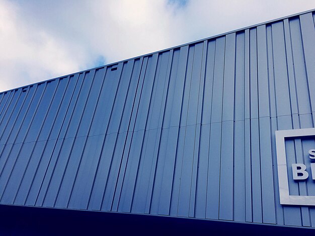 Low angle view of metal against sky