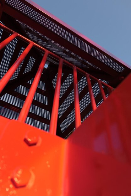 Low angle view of metallic built structure against sky