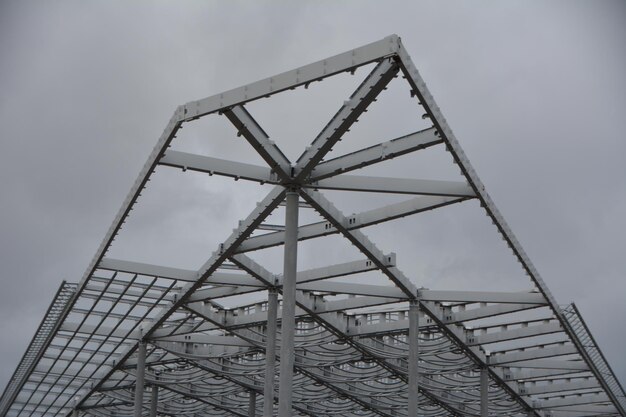 Low angle view of metallic structure against sky